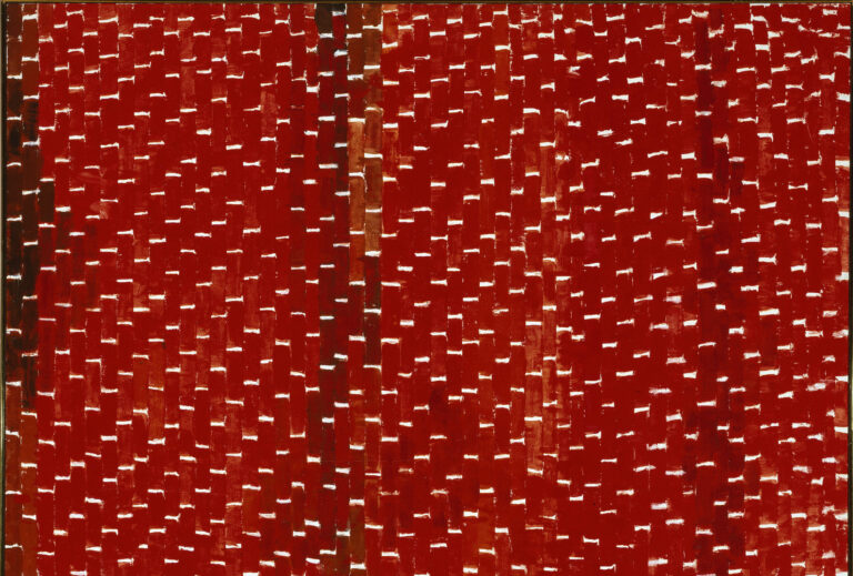 Painting features vertical tile-shaped brushstrokes in various shades of red separated by horizontal white lines. Creating a rhythmic and mosaic-like pattern that resembles stitching, the white lines create stair steps in the lower right corner, separating as they move towards the center.