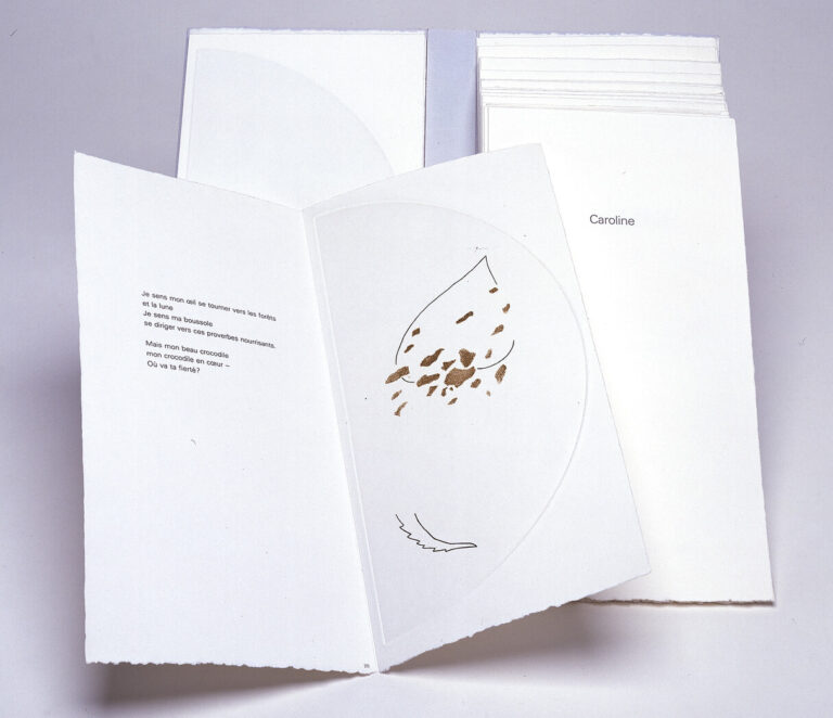 An open book with torn-edge white pages, showing text in French on the left and an abstract brown and black illustration on the right; other closed books or pages are stacked in the background.