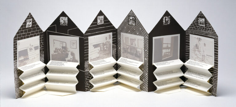 An open accordion-style book in the shape of a house. On each page is a black and white graphic background and a washed-out black and white photograph. Beneath each image is typed text on accordion folded paper.