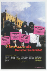 A poster shows four figures who are wearing gorilla masks and standing in front of a Venetian building. They hold pink picket signs. Red text beneath them reads, “Benvenuti alla Biennale Femminista!”