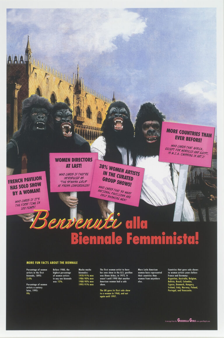 A poster shows four figures who are wearing gorilla masks and standing in front of a Venetian building. They hold pink picket signs. Red text beneath them reads, “Benvenuti alla Biennale Femminista!”