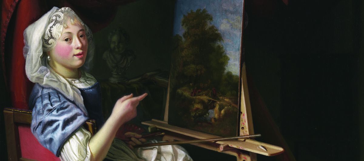 A woman in historical clothing sits at an easel, painting a landscape. She looks at the viewer, pointing at her artwork. The scene is set indoors with dark drapery and a shelf in the background.