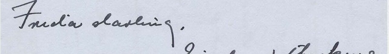 Handwritten letter on gray paper.