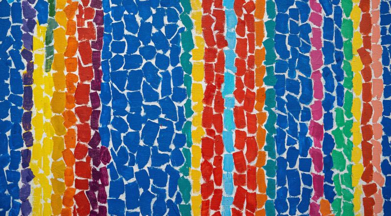 Abstract painting composed of brightly colored, lozenge-shaped brushstrokes in vertical stripes of navy, purple, turquoise, yellow, orange and red.The overall effect is as if the painting was collaged out of torn pieces of paper, with the white of the canvas showing through.