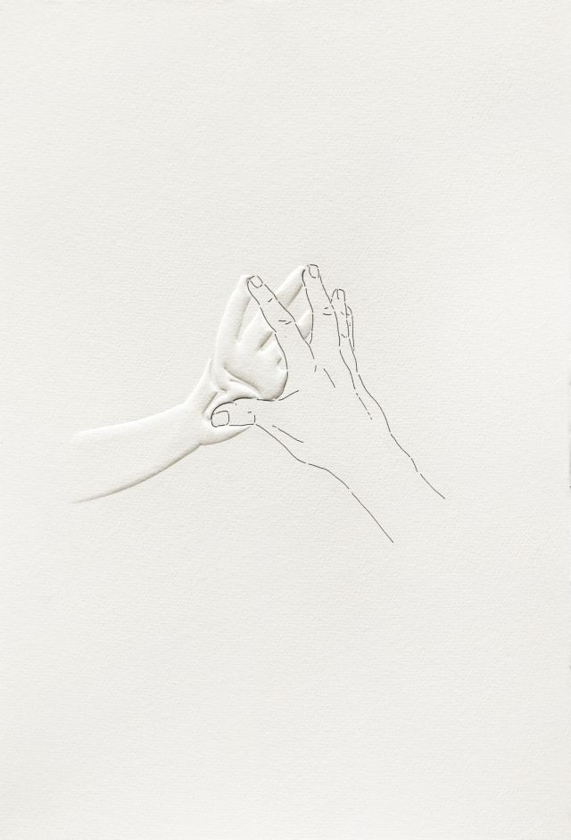 An image of two hands touching by their fingertips. The back of one hand is drawn on the paper and the palm of the other is embossed.