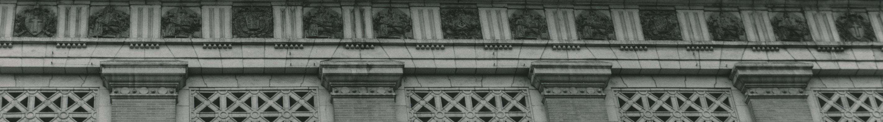 Black and white photograph of the museum exterior with a view of the upper half of the facade.
