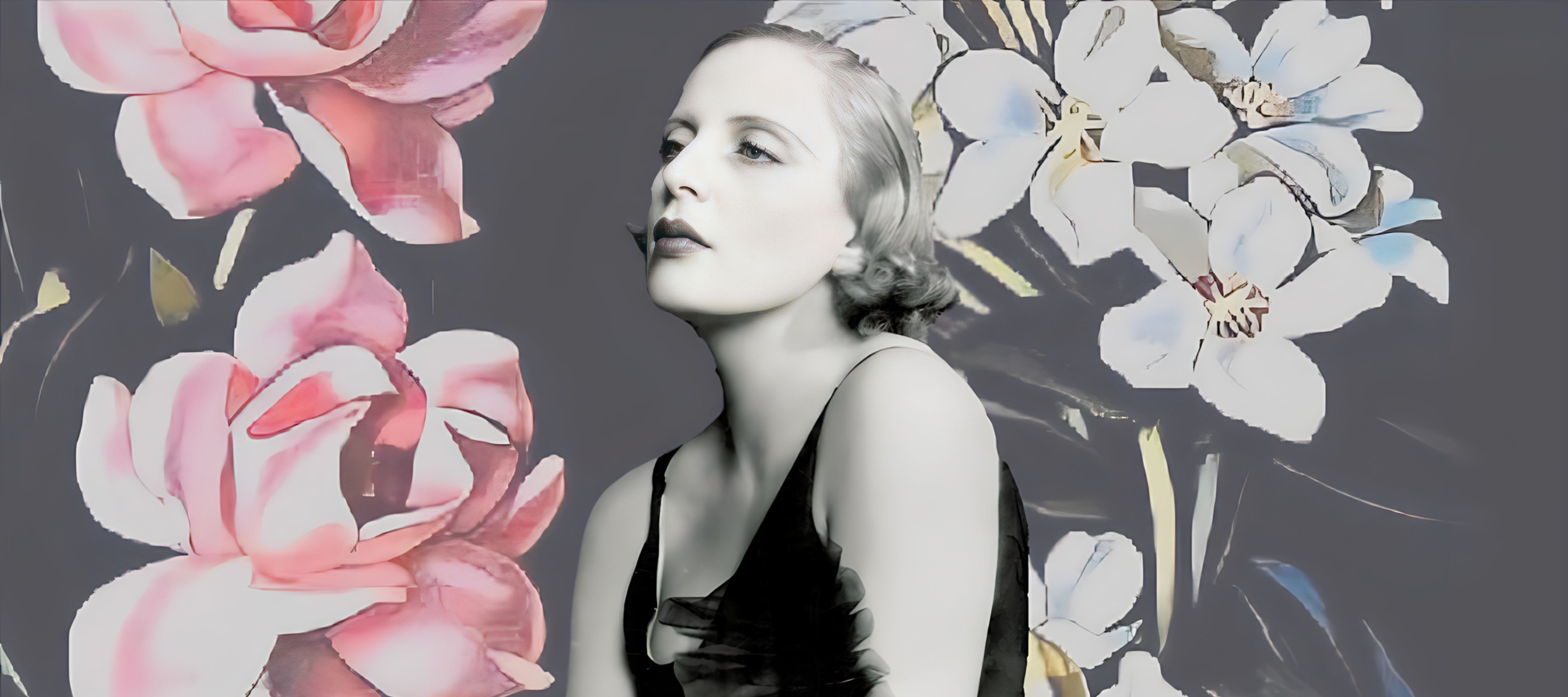 A woman in a black dress poses against a dark background with large, stylized pink and white flowers. The image has a vintage, artistic feel with soft, muted colors.