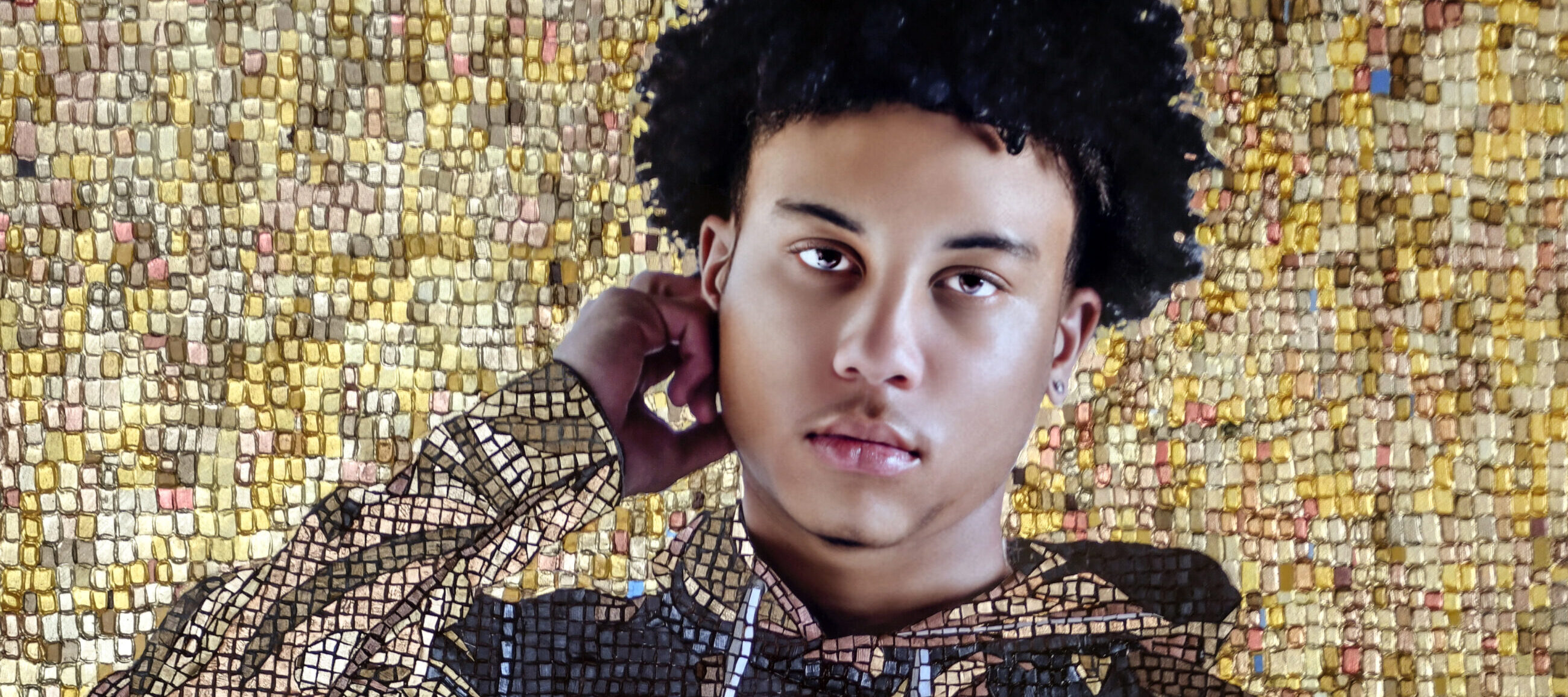 A mosaic style painting of a young brown skinned boy with black curly hair, who stands facing the viewer. He is wearing a brown hoodie sweatshirt, with the image of a parent holding their child on it. He and the background behind him is created from an elaborate layered mosaic of largely golden and brown hued square tiles.